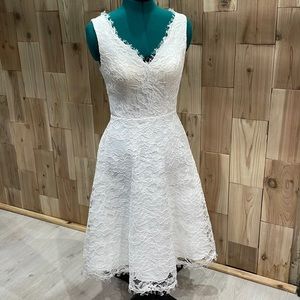 Beautiful white tea length lace fit and flare dress.
